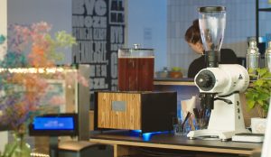 A cold brew machine in a café setting.