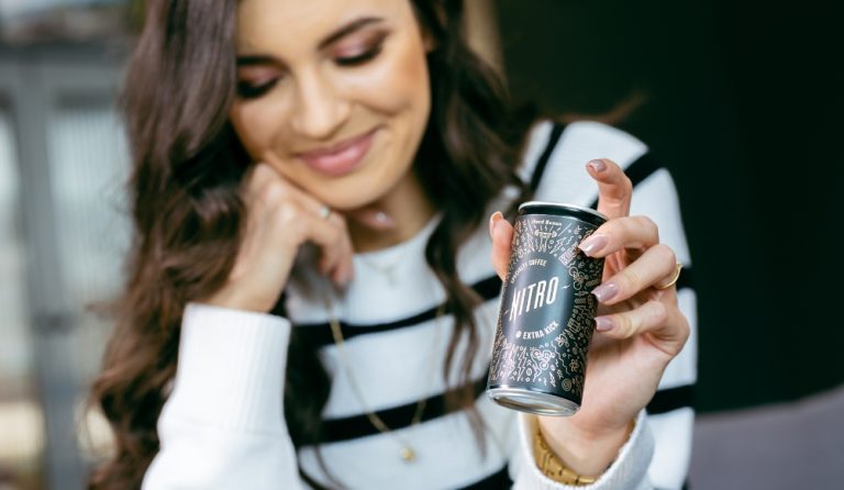 Young people prefer RTD coffee – the data behind shifting preferences in the coffee industry 7 RTD coffee held by woman