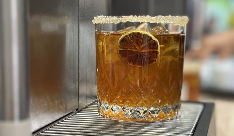 Glass with cold tea brewed with a Hardtank commercial cold brew machine.