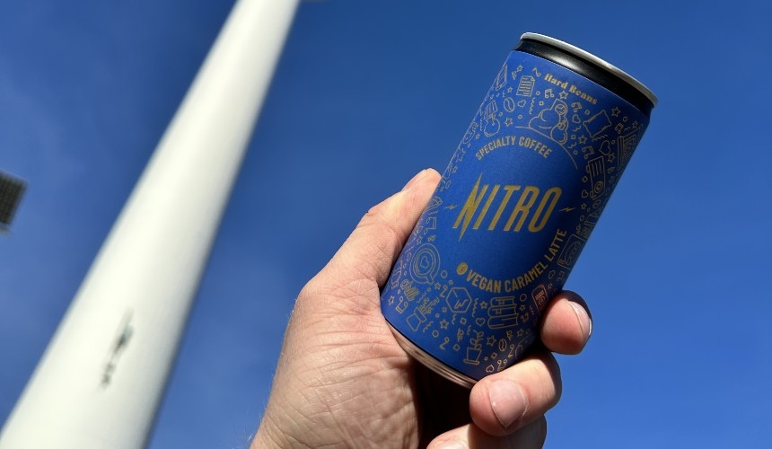 A person holding a can of Hardtank's private label functional drinks.