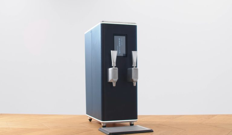 The Hardtap dispenser on a wooden countertop.