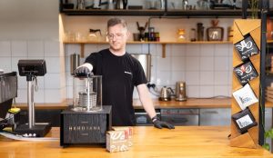 A coffee roaster preparing cold brew in an article on the cold brew extraction time.