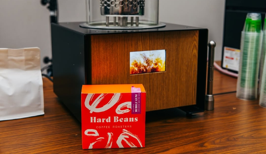 Cold brew coffee production bottlenecks: The real risks and fast fixes for cafés 2 A Hardtank machine alongside a box of coffee from Hard Beans.
