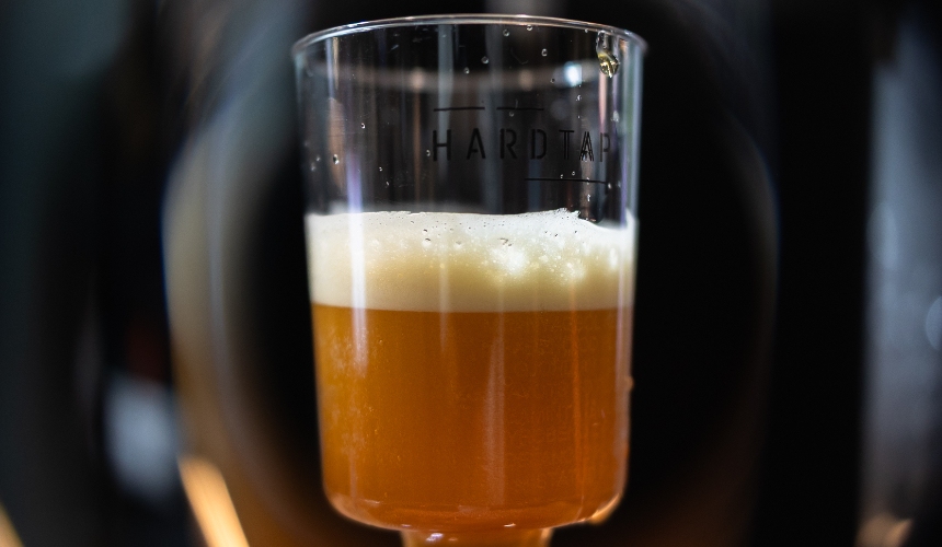 Commercial cold brew with nitro infusion in a small glass.