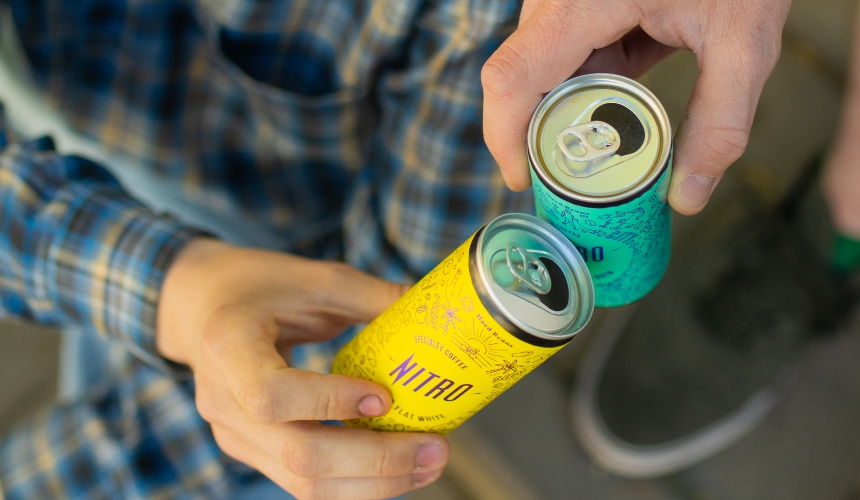 How to start RTD functional drink development (with a private label partner) 3 Two people holding RTD cans.