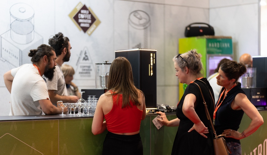 People huddled around a Hardtap cold brew tap.