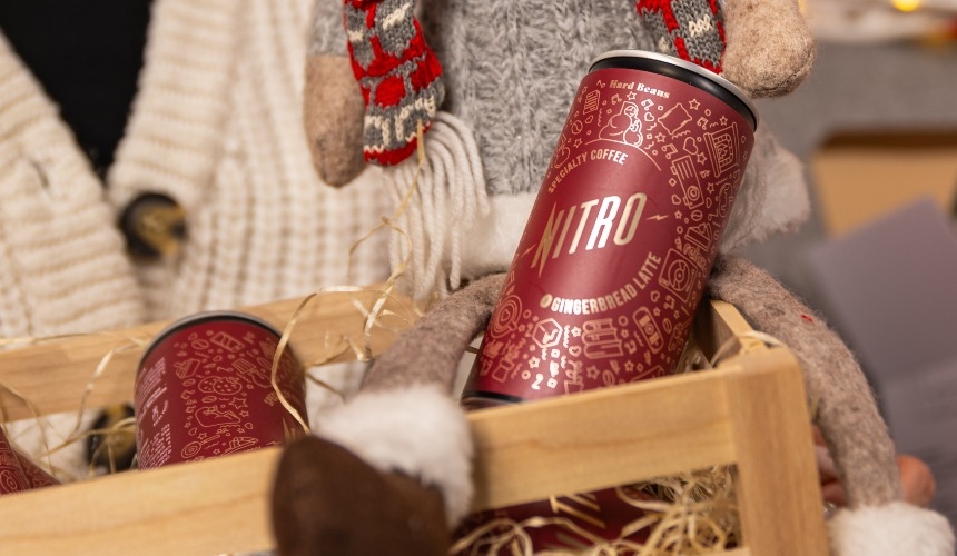 A basket containing canned gingerbread lattes, an example of the best RTD drinks.