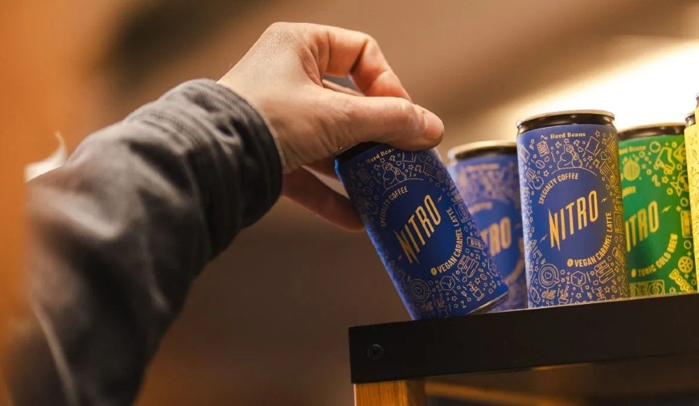 Why matcha RTD products are so popular – and how the landscape is changing 1 A person picking up a matcha RTD drink from a retail shelf.