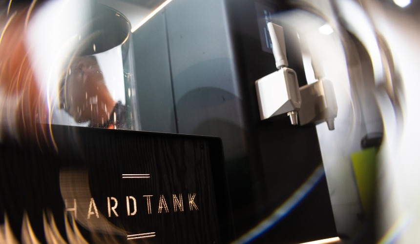 How can a nitro coffee tap reduce waste for coffee shops? 2 A nitro coffee tap next to a Hardtank machine.