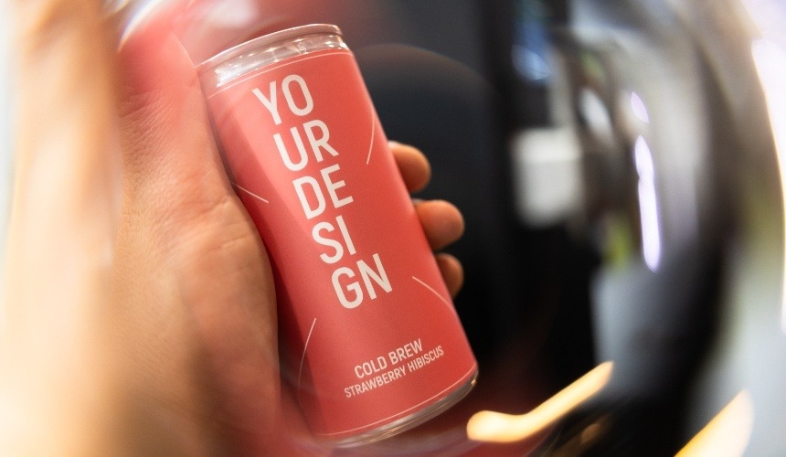 Should you offer private label matcha to your customers? 3 A person holding a can of private label cold brew.