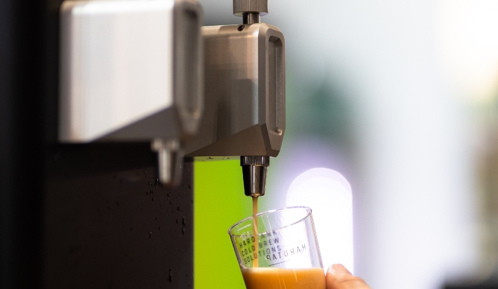 The 5 key features you need in a cold brew coffee dispenser 1 A cold brew coffee dispenser pouring nitro cold brew.