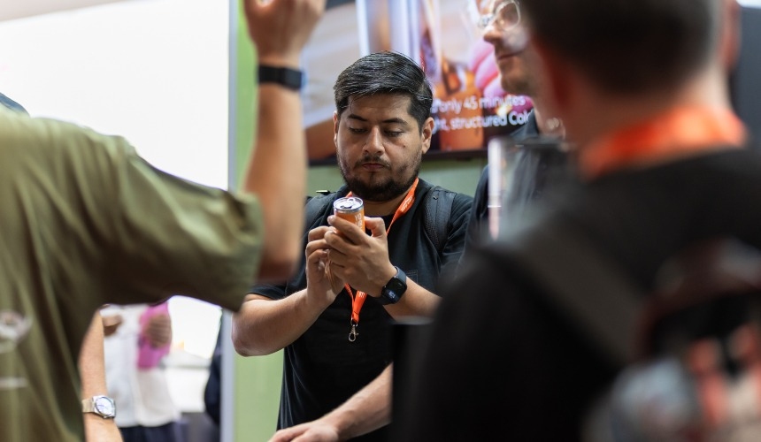 A person assessing the matcha latte caffeine content holding an RTD can.