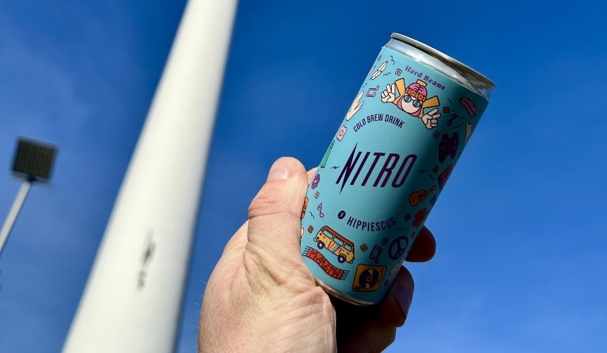 How to choose the best commercial iced coffee equipment for RTDs 4 A person holding a can of RTD cold brew coffee.