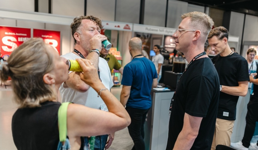 A group of people drinking white label matcha RTDs from Hardtank.