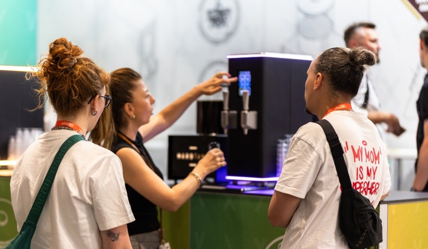 A group of people drinking nitro cold brew dispensed by the Hardtap.